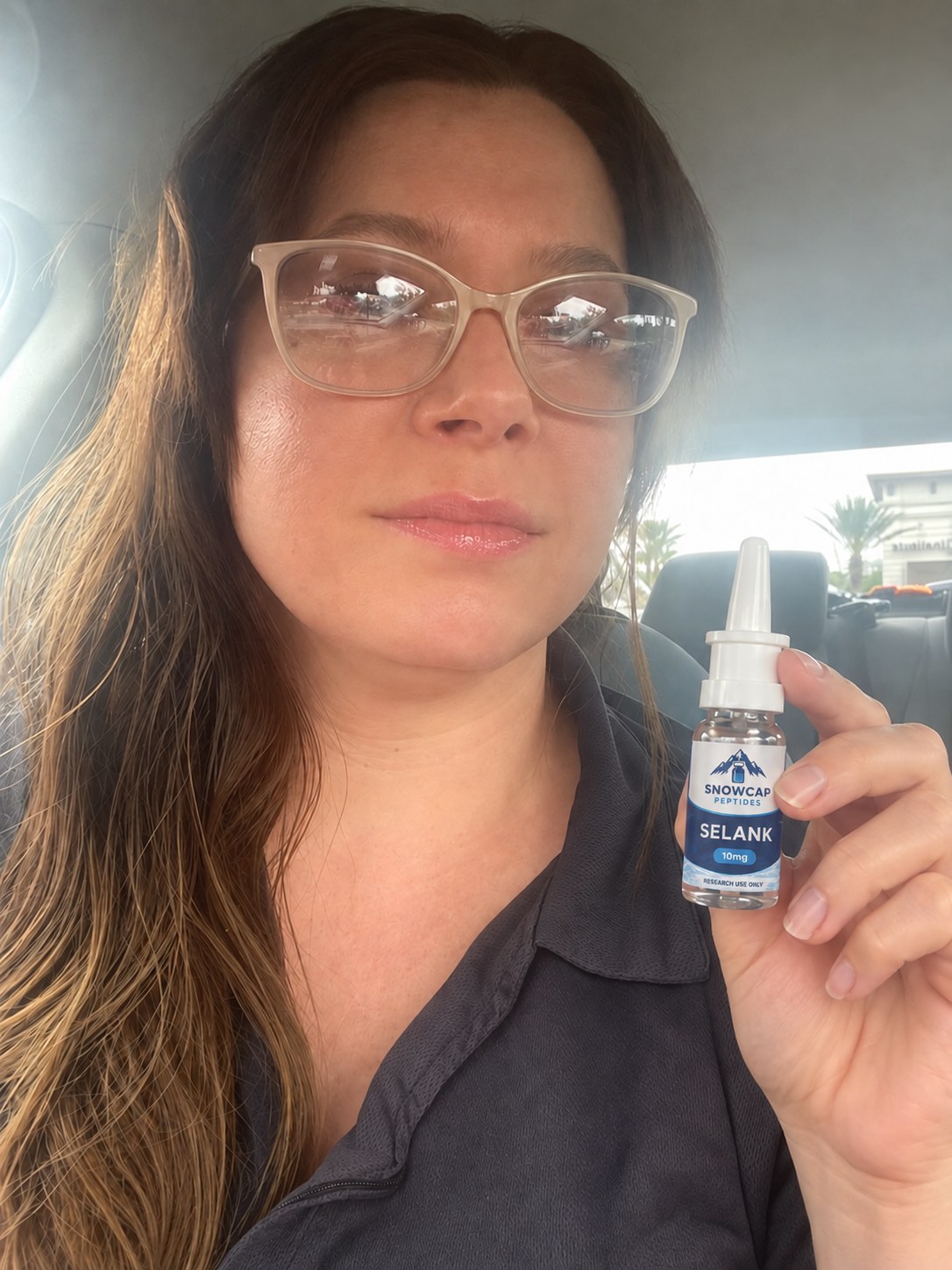 Customer holding Snowcap Selank Nasal Spray